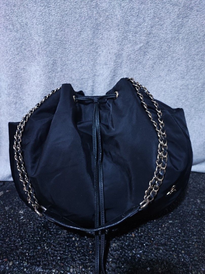Agnès b. Black Nylon Drawstring Chain Bucket Bag (Category: Shoulder Bags) located in Baguio. Submitted by ozara.06 (Listing ID 1469829336, Image 2). Description: Agnes B. Long strap shoulder bag Medium near large Very nice nito In very good condition 680.