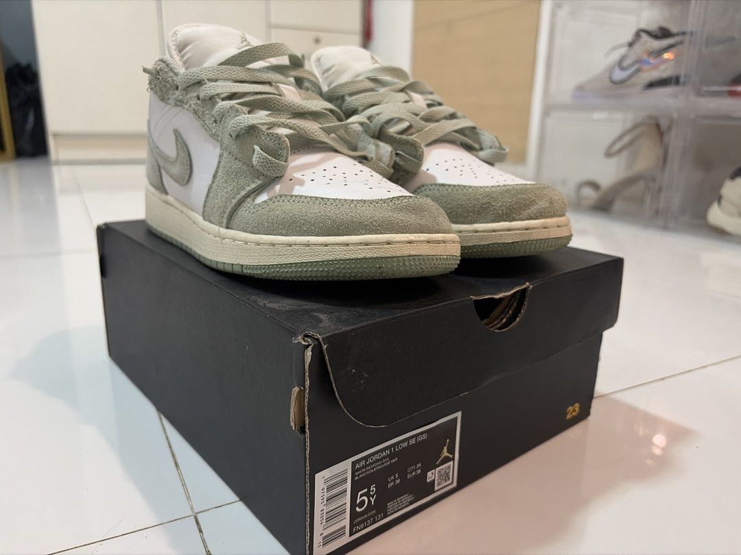 Air Jordan 1 Low SE Seafoam (Category: Sneakers) located in Paranaque City. Submitted by jobzrb (Listing ID 1469878707, Image 3). Description: - Model: Air Jordan 1 Low SE (Seafoam) - Sizing: Grade School (GS) - Condition: Clean midsoles, solid tread, great everyday pair - Design: White leather base with light green fuzzy suede overlays - Inclusion: Comes with original black box.
