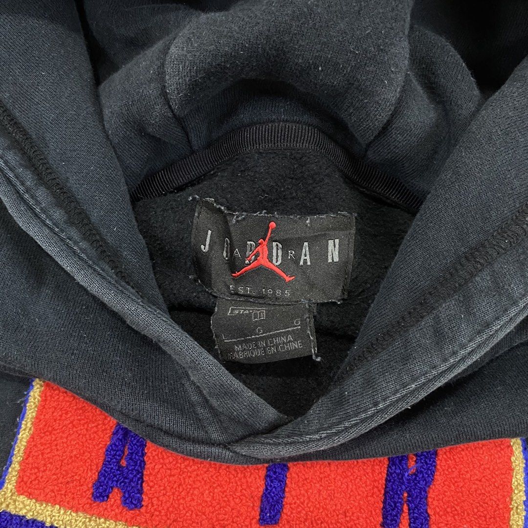 Air Jordan Navy Blue Pullover Hoodie Size L (Category: Coats, Jackets and Outerwear) located in Cagayan de Oro. Submitted by sepamorash53558 (Listing ID 1469795732, Image 3). Description: - Brand: Air Jordan - Color: Navy blue with red accents - Size: Large (Flat lay: 22" pit-to-pit, 27" length) - Material: 82% cotton, 18% polyester - Design: Large embroidered shield logo on chest - Features: Drawstring hood with red stripes, front kangaroo pocke