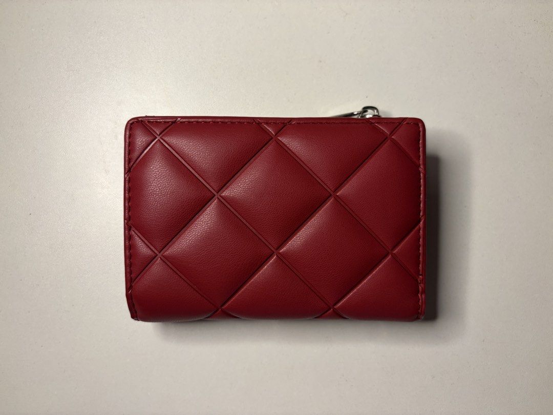 Alberto Red Quilted Leather Wallet (Category: Wallets & Card holders) located in Imus. Submitted by jpgworks (Listing ID 1469925495, Image 1). Description: - Color/Finish: Rich red quilted faux leather - Design: Compact bifold with secure magnetic snap closure - Storage: Multiple interior card slots and exterior card slots on the front flap - Coin Pocket: Convenient top zippered coin compartment - Details: Chic small silver hardware accent - Size
