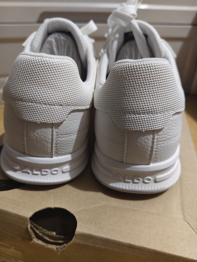 ALDO Jeremie White Sneakers (Category: Sneakers) located in San Juan City. Submitted by jzurc19 (Listing ID 1469840059, Image 2). Description: - Brand: ALDO (Model: Jeremie) - Color: Classic White - Condition: Brand new, 100% spotless outsoles, never worn outside - Material: Clean white leather upper with textured heel panel - Details: Embossed logo on the midsole - Inclusion: Comes with original shoe box and internal paper stuffing - Rationale f