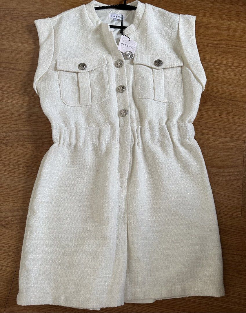 Aleshia White Tweed Romper Size M (Category: Rompers) located in Mandaluyong City. Submitted by unworntobarelyworn (Listing ID 1469853312, Image 1). Description: - RFS: ordered the wrong size - Brand: Aleshia - Condition: Brand new with tags (BNWT), never worn - Size: M - Color: White - Material: Textured tweed, fully lined interior - Details: Sleeveless, round neckline, elastic waistband, front button closure, dual chest flap pockets, silver orn