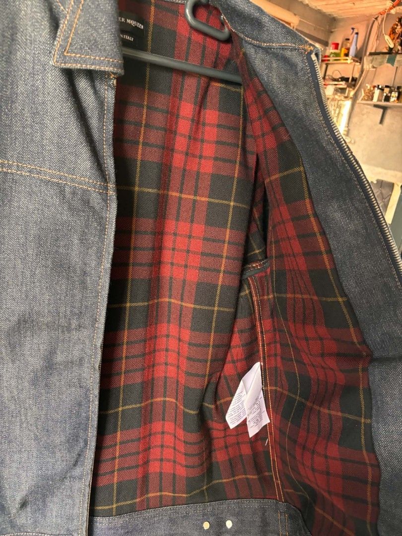Alexander McQueen Denim Jacket with Tartan Lining Size 50 (Category: Coats, Jackets and Outerwear) located in Manila. Submitted by jessamarie95205 (Listing ID 1469889589, Image 2). Description: - Brand: Alexander McQueen - Item: Dark Denim Zip-Up Jacket - Size: 50 (Made in Italy) - Condition: Brand new with tag attached (includes style numbers and barcode) - Lining: Red tartan plaid interior - Pockets: Single chest pocket and front side pockets -