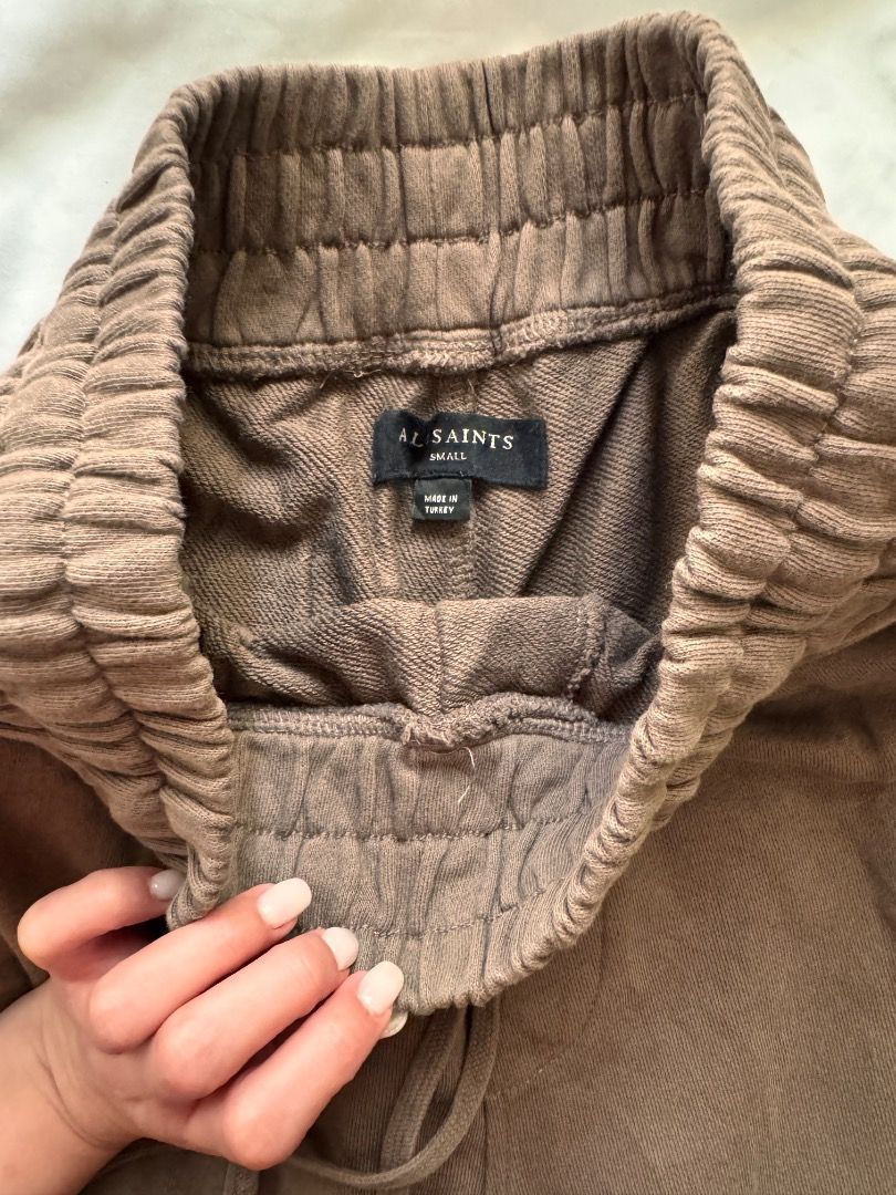 AllSaints Brown Cargo Sweatpants Size S (Category: Joggers) located in Cebu City. Submitted by txproj27 (Listing ID 1469792853, Image 3). Description: - Brand: AllSaints - Color: Brown - Size: Small (180/78A) Can fit up to Medium - Material: 100% Cotton with super comfortable fleece lining (Made in Turkey) - Waistband: Thick elastic with adjustable drawstring closure - Cuffs: Ribbed ankle cuffs - Pockets: Large utility cargo pockets on both legs 