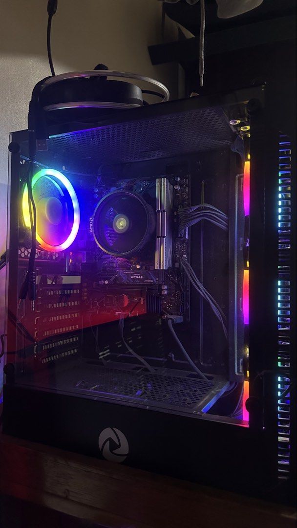 AMD Ryzen 5 5600GT System Unit (Category: Desktops) located in Rizal. Submitted by kxithlynn (Listing ID 1469888678, Image 2). Description: Ryzen 5 5600GT processor paired with 16GB RAM and 512GB NVMe storage. Gigabyte B450 motherboard inside an Inplay Meteor 03 BK case with colorful RGB fans. Powered by an Inplay 750W unit. Includes Windows 11 Pro installed. Great daily driver for work and casual gaming. FULL SPECS: RYZEN 5 5600GT GIGABYTE B450 