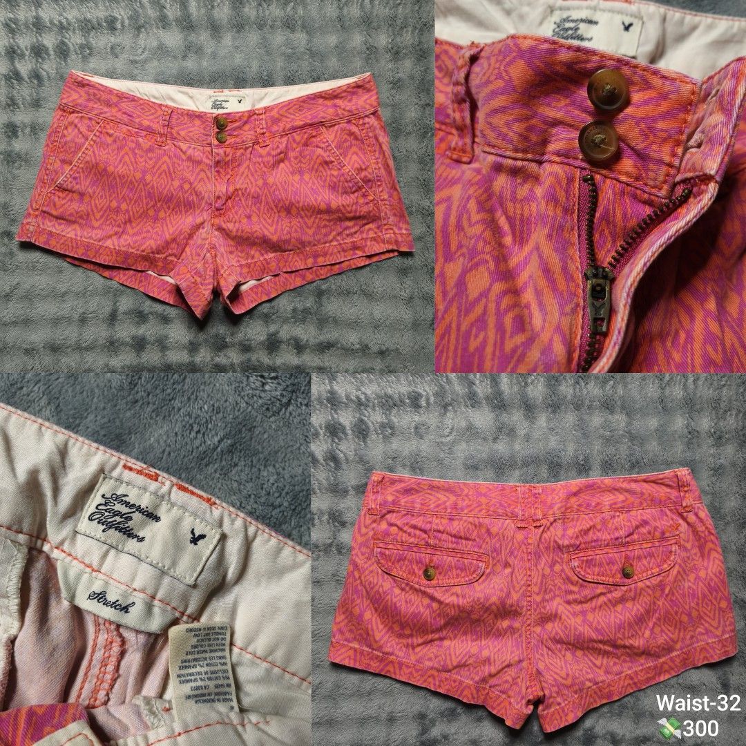 American Eagle Outfitters Pink Patterned Stretch Shorts Size 32 (Category: Shorts) located in Floridablanca. Submitted by vintager12 (Listing ID 1469866644, Image 1). Description: - Brand: American Eagle Outfitters - Size: 32 - Color/Pattern: Pink & orange geometric print - Material: Stretch cotton & spandex blend - Closure: Double button with front zipper - Pockets: Back button flap pockets - Origin: Made in Indonesia.
