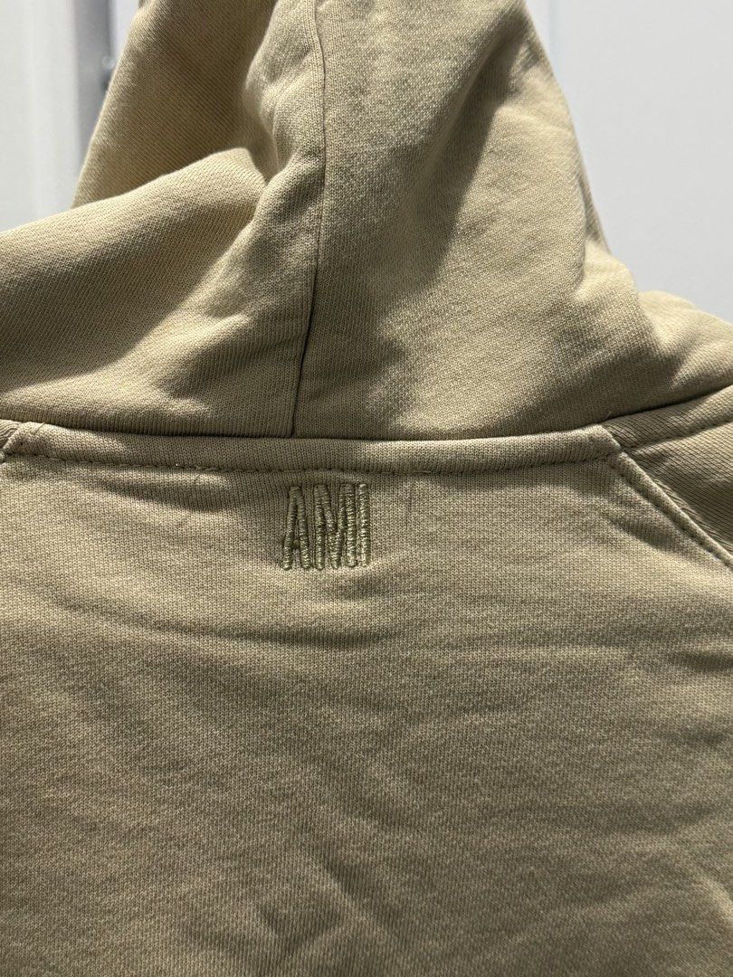 Ami Paris Beige Hooded Sweatshirt (Category: Hoodies) located in Quezon City. Submitted by vvandko (Listing ID 1469878014, Image 3). Description: AMI Paris Hoodie 🤎 Used once for an airport fit! Measurements: • Chest: 22” (pit-to-pit) • Length: 26” • Sleeve length: 28”.