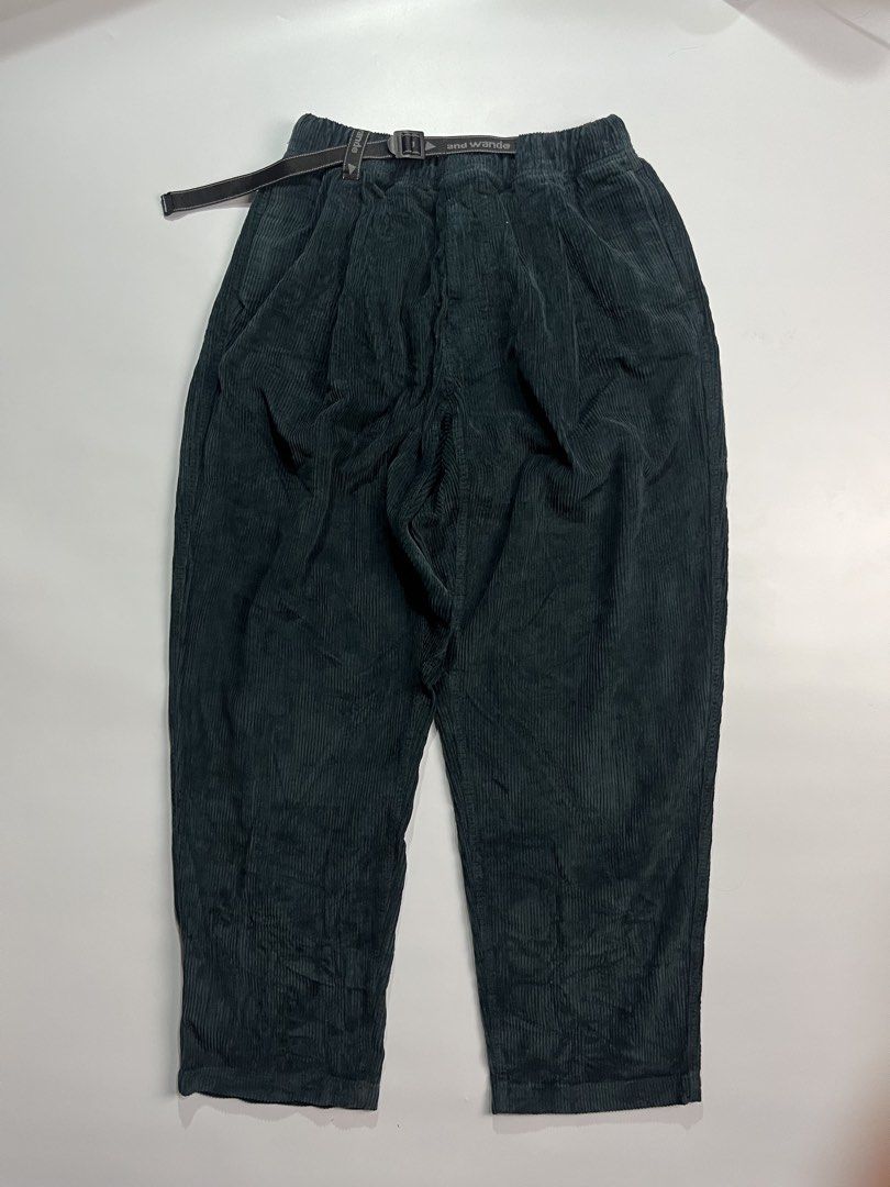 And Wander Corduroy Climbing Pants (Category: Jeans) located in Iloilo. Submitted by kahit.ano.na.lang (Listing ID 1469819425, Image 1). Description: - Brand: And Wander - Color: Dark green - Material: Clean-textured corduroy - Fit: Relaxed tapered leg - Waist: Elastic waist with built-in adjustable branded webbing belt and buckle closure - Design: Pleated front, rear pockets with embroidered logo text - Special Detail: Interior brand patch featu
