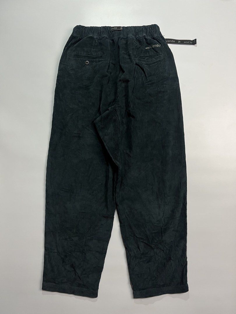 And Wander Corduroy Climbing Pants (Category: Jeans) located in Iloilo. Submitted by kahit.ano.na.lang (Listing ID 1469819425, Image 2). Description: - Brand: And Wander - Color: Dark green - Material: Clean-textured corduroy - Fit: Relaxed tapered leg - Waist: Elastic waist with built-in adjustable branded webbing belt and buckle closure - Design: Pleated front, rear pockets with embroidered logo text - Special Detail: Interior brand patch featu