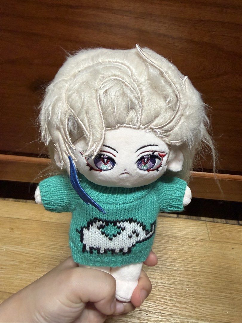 20cm Neuvillette w/ Skeleton (Category: Plushies & Soft Toys) located in Manila. Submitted by mysticmoon.bc808c (Listing ID 1469869200, Image 3). Description: Plush doll featuring embroidered purple eyes and stylized white hair. Wears a turquoise knitted sweater decorated with a white animal graphic. Long hair flows down the back. Soft fabric construction, well-suited for collectors or fans of character merchandise..