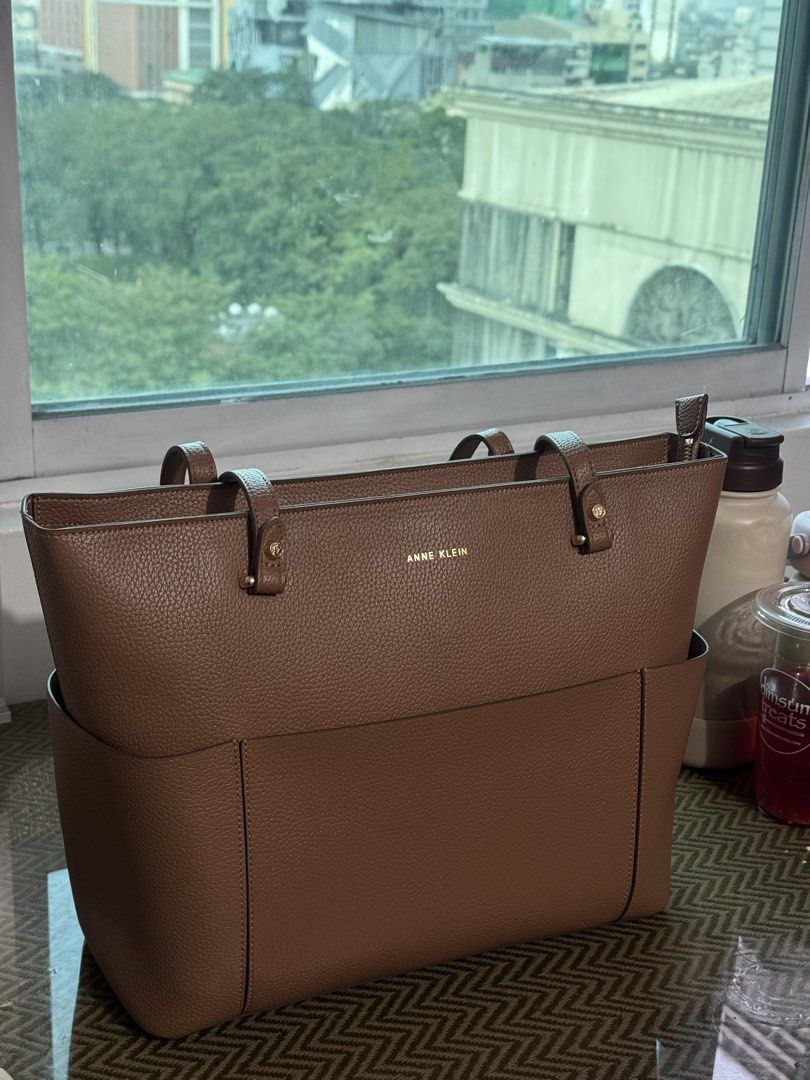 Anne Klein Brown Pebble Grain Tote Bag (Category: Shoulder Bags) located in Manila. Submitted by zaigrnm (Listing ID 1469858771, Image 1). Description: Never been used, just kept in storage. Still in good condition, with some peeling on the strap only (please see photos for reference). RFS: It’s a gift that I never got to use.