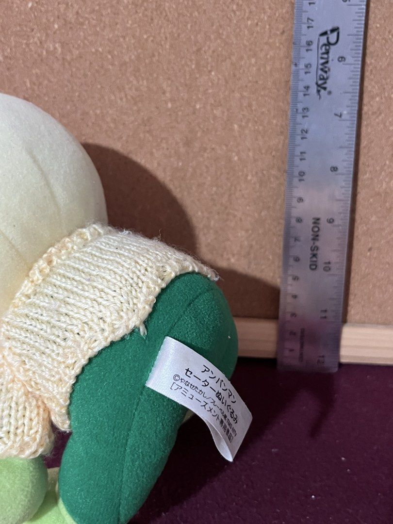 Anpanman Melonpanna Sweater Plush Toy (Category: Plushies & Soft Toys) located in Baguio. Submitted by gaara1234 (Listing ID 1469792532, Image 2). Description: - Character: Melonpanna from the popular Anpanman series - Outfit: Cream knitted sweater with a green 'M' initial and matching green pants, hands, and feet - Features: Big embroidered green eyes, cute pink facial markings, and a golden string loop on top for hanging - Condition: Brand new 