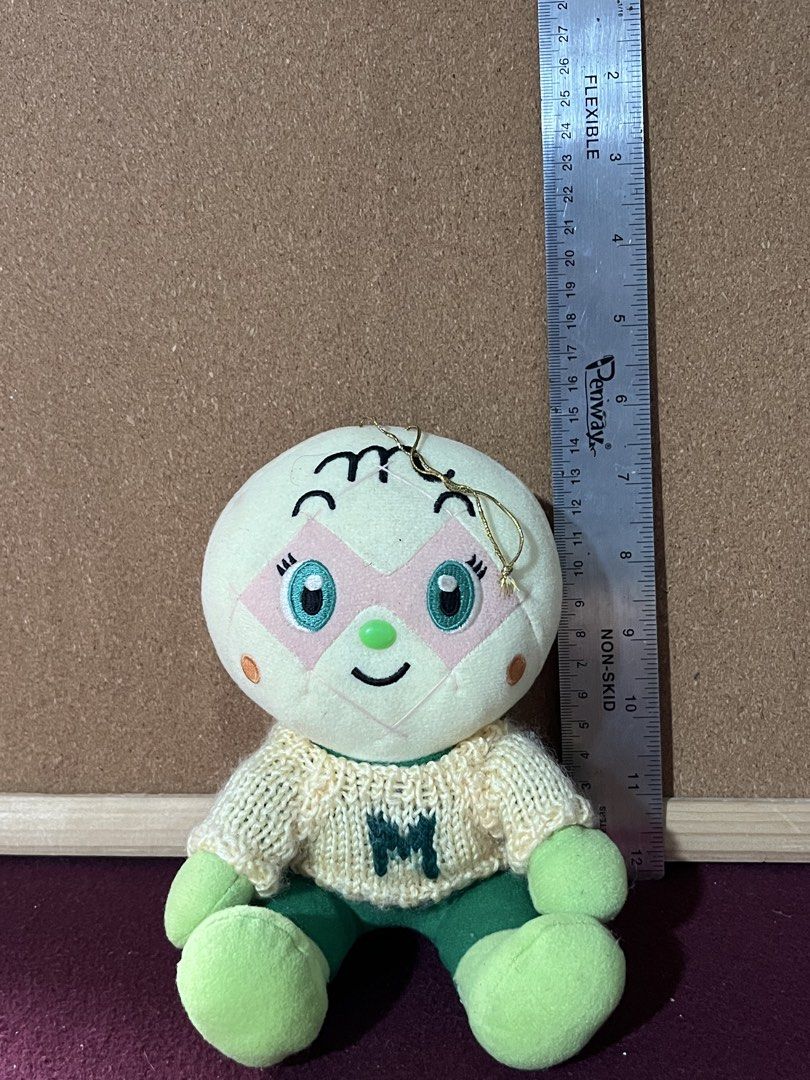 Anpanman Melonpanna Sweater Plush Toy (Category: Plushies & Soft Toys) located in Baguio. Submitted by gaara1234 (Listing ID 1469792532, Image 1). Description: - Character: Melonpanna from the popular Anpanman series - Outfit: Cream knitted sweater with a green 'M' initial and matching green pants, hands, and feet - Features: Big embroidered green eyes, cute pink facial markings, and a golden string loop on top for hanging - Condition: Brand new 
