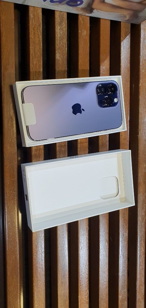 Apple iPhone 14 Pro Max Deep Purple (Category: iPhone 14 Series) located in Quezon City. Submitted by lj.04 (Listing ID 1469762362, Image 1). Description: - Model: Apple iPhone 14 Pro Max - Color: Deep Purple - Battery Health: 87% maximum capacity - Condition: Well-maintained, smooth performance, minor scratches - Inclusions: Original box and charging cord(not used) + 2 free dbrand skins (Circuit Board & White Topographic designs).