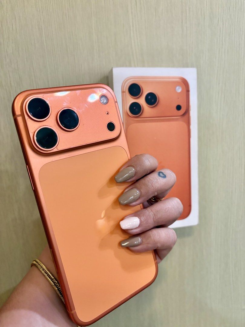 Apple iPhone 17 Pro Max Cosmic Orange Factory unlocked (Category: iPhone 17 Series) located in Mandaluyong City. Submitted by Janellas24 (Listing ID 1469870655, Image 2). Description: - Model: Apple iPhone 17 Pro Max - Local variant (from Mac store) - 305cc 93% Batt health - Condition: Flawless screen with zero visible scratches. Pwedeng pwede sa maarte - Factory unlocked (no sim restrictions) - Features: Advanced triple rear camera setup and mod