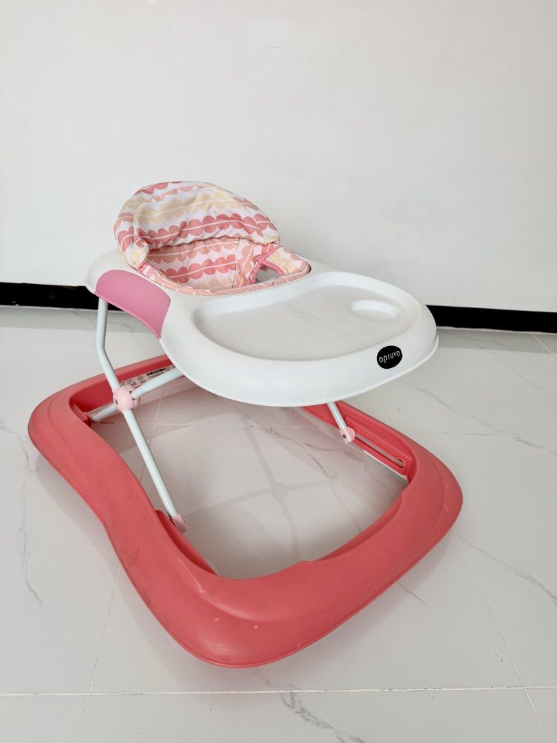 Apruva Pink Baby Walker (Category: Infant Playtime) located in Las Pinas. Submitted by lykarabino (Listing ID 1469808764, Image 1). Description: ‼️Apruva Baby Walker‼️ - Brand: Apruva - Color: Pink and white with pastel patterned seat - Design: Sturdy frame with a wide base for maximum stability - Mobility: Smooth-rolling wheels and convenient back push handle - Features: Built-in activity tray with a cup holder slot - Condition: Clean, comfortab