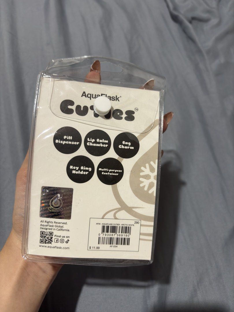 AquaFlask Cuties Multi-Purpose Container Keychain (Category: Water Bottles & Tumblers) located in Manila. Submitted by izzmya (Listing ID 1469921899, Image 3). Description: - Brand: AquaFlask Cuties Mini Container - Color: Arctic White - Condition: Brand new with tag in original packaging - Multi-purpose: Acts as a pill dispenser, lip balm chamber, bag charm, and key ring holder - Convenience: Super handy accessory to clip on your keys or bags.