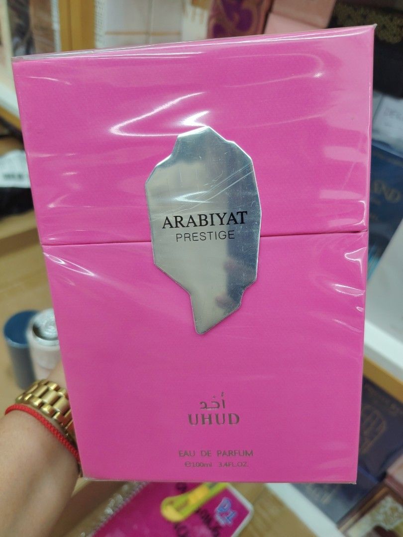 Arabiyat Prestige Uhud Eau De Parfum 100ml (Category: Fragrance & Deodorants) located in Pasay City. Submitted by perfume.ph (Listing ID 1469821603, Image 3). Description: - Brand: Arabiyat Prestige Uhud - Volume: 100ml Eau De Parfum - Condition: Brand new, factory sealed in original pink box - Scent Profile: Sweet and warm - Top Notes: Red fruits, rose, caramel - Heart Notes: Tonka bean, honey, raspberry - Base Notes: Musk, vanilla, amber.