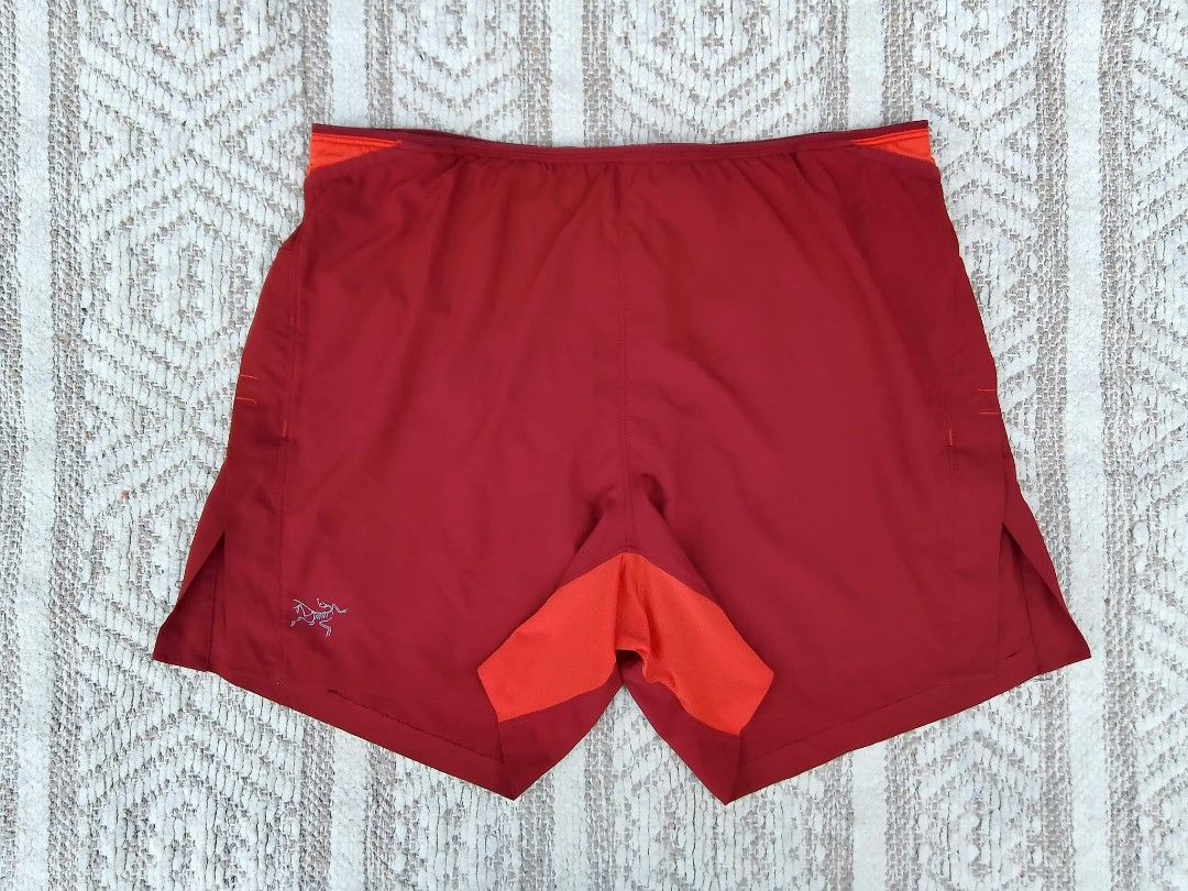 Arc'teryx Men's Running Shorts Size S Red Orange (Category: Shorts) located in Quezon City. Submitted by cruz_robert (Listing ID 1469807643, Image 1). Description: - Brand: Arc'teryx - Item: Men's Running Shorts - Size: Small to medium - Color: Deep red with orange contrast panels and inner lining - Liner: Built-in mesh brief liner for comfort - Waistband: Elastic with internal drawcord - Pocket: Back stash pocket at the waist - Branding: Reflect