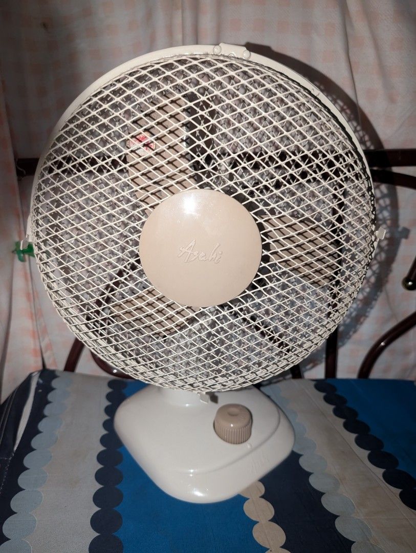 Asahi Vintage Small Desk Fan (Category: Fans) located in Sison. Submitted by geralyn_21 (Listing ID 1469800555, Image 1). Description: - Vintage cream and beige design - Compact size fits perfectly on desks and small tables - Mesh safety grille with classic Asahi script logo - Simple single-control dial for power and speed - Efficient cooling for small spaces.