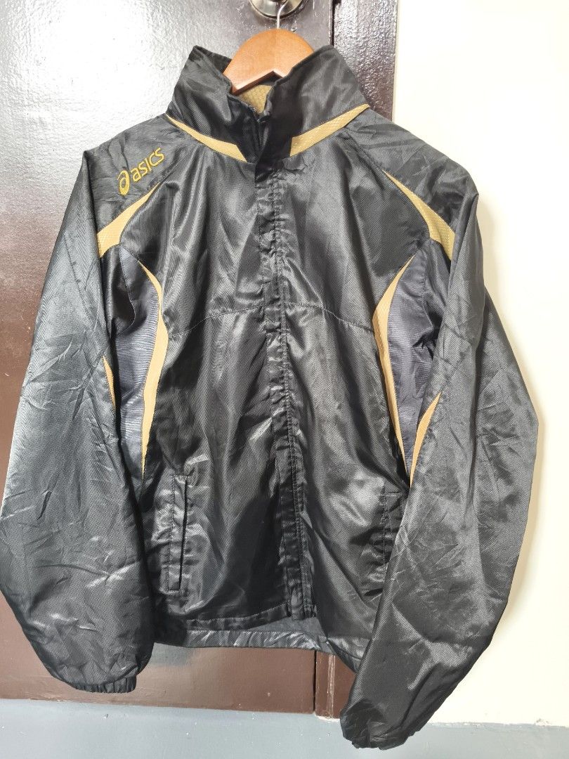Asics Black And Gold Windbreaker Jacket (Category: Coats, Jackets and Outerwear) located in Manila. Submitted by ian.frias_ (Listing ID 1469841388, Image 1). Description: Asics windbreaker in black with gold stripe accents. Lightweight material with ribbed cuffs and full zip front. Classic sports jacket design from Asics. Great piece for runs or casual wear..