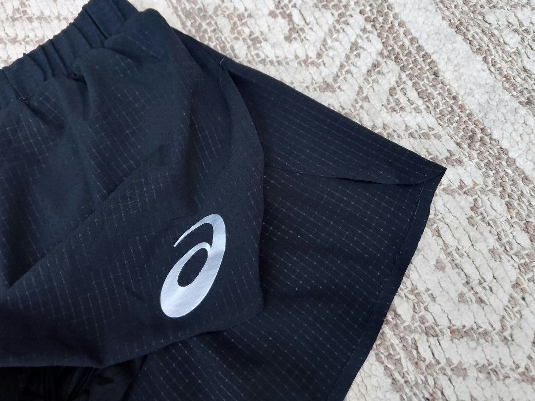 Asics Black Running Shorts Size M (Category: Announcements) located in Quezon City. Submitted by cruz_robert (Listing ID 1469807044, Image 2). Description: Asics Actibreeze Racing Split short - Color: Black with checkered texture pattern - Size: Medium - Features: Elastic waistband and comfortable inner lining - Safety: Reflective Asics logo on the left leg for low-light visibility - Tag Info: Style number 2092A424 - Condition/Use: Lightweight at