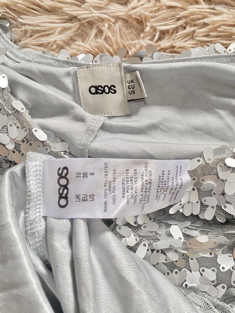 ASOS Silver Sequin Sleeveless Mini Dress (Category: Dresses) located in Manila. Submitted by stormibutterfly26 (Listing ID 1469799109, Image 2). Description: ASOS silver sequin sleeveless party dress in UK 10 / US 6. Size S-M, Features a scoop neck, fitted waist, flared skirt, and full polyester lining. Has a nice, premium weight to it..