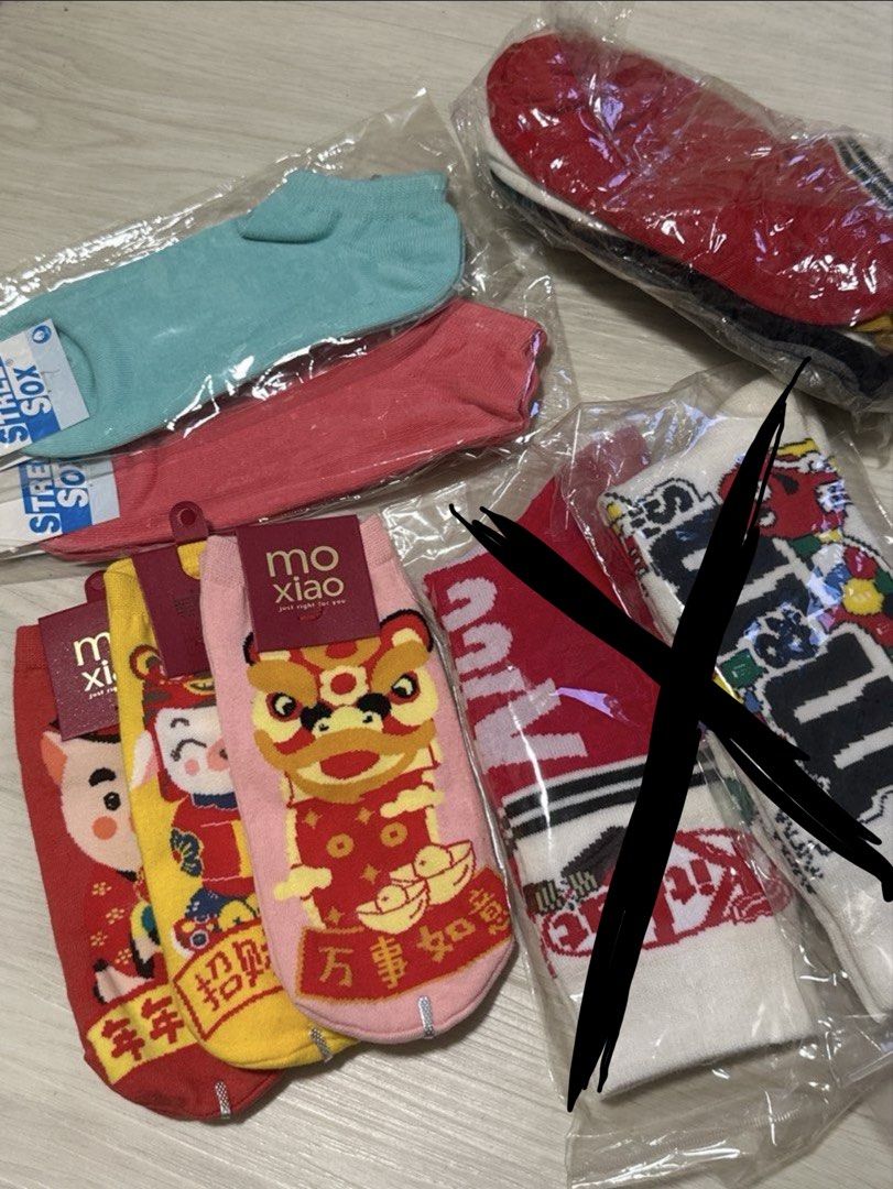 Assorted socks (Category: Socks & Tights) located in Singapore. Submitted by xuanide (Listing ID 1469896790, Image 1). Description: 5 pairs ankle socks in a bag - $5 2 plain coloured ankle socks - $1/pair Cny ankle socks - $1.20/pair, buy all 3 @ $3.