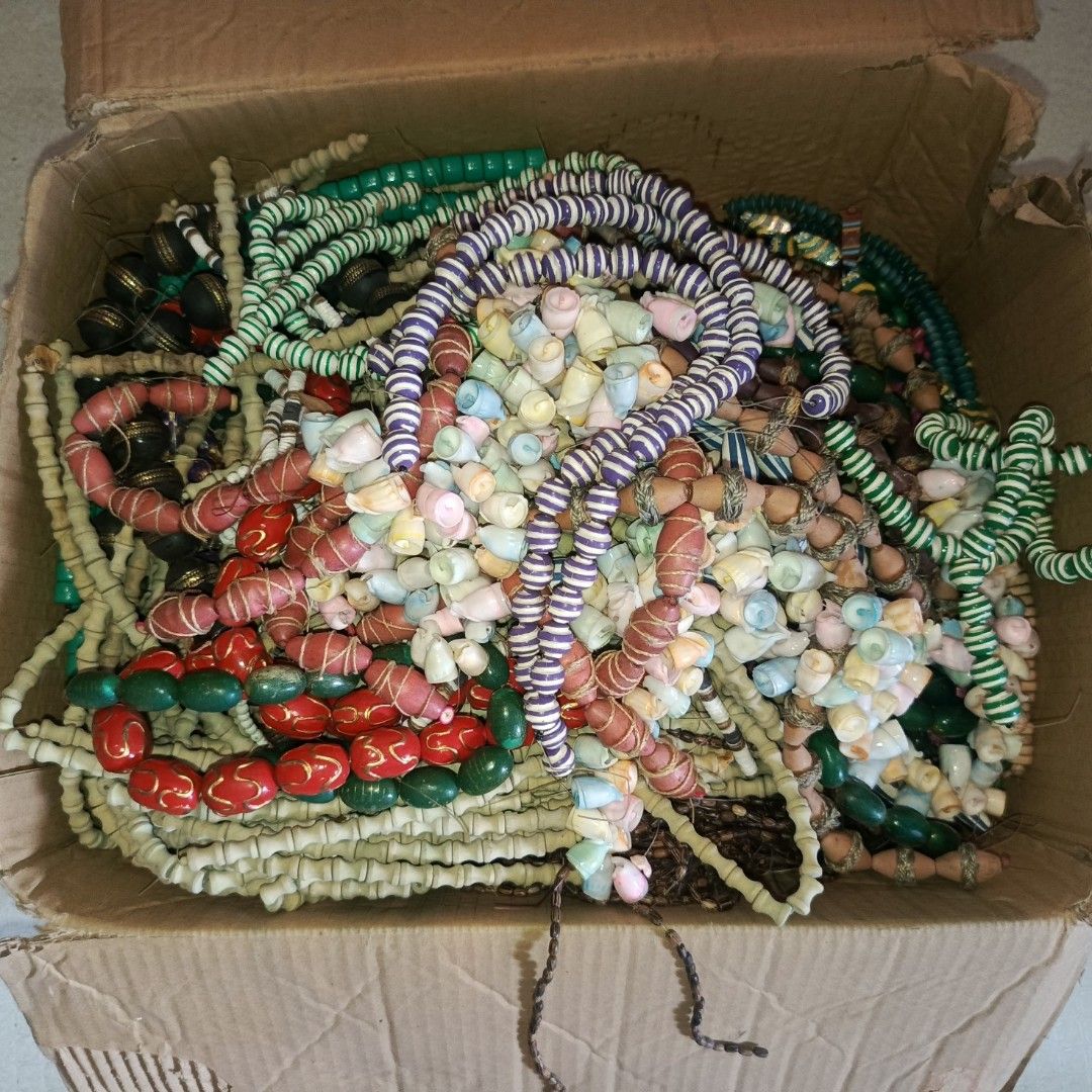 Assorted Wooden Beads (Category: Necklaces) located in Bulacan. Submitted by snumxxx (Listing ID 1469801502, Image 1). Description: - FOR TAKE ALL, HINDI PER PIECE - Large assorted lot of beads - Features vibrant colors like red, green, purple, white, and black - Includes carved wooden beads, patterned beads, and small shell necklaces - Ideal for DIY craft projects, jewelry making, or online resale - Shipped in a mixed lot box.
