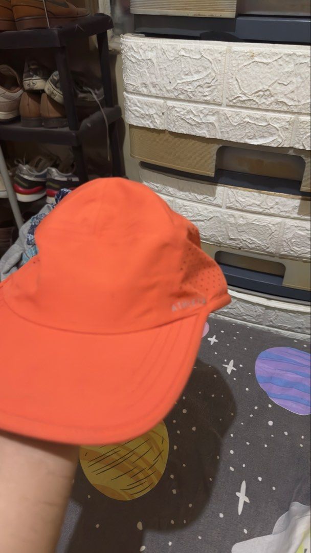 Athleta Orange Running Hat One Size Lightweight Ventilated Reflective (Category: Hats & Beanies) located in Plaridel. Submitted by estanislao.noveno (Listing ID 1469790187, Image 1). Description: - Brand: Athleta - Color: Bright orange - Size: One size fits all with an adjustable bungee cord at the back - Material: Lightweight polyester with laser-cut ventilation holes - Features: Subtle reflective logo near the brim - Care: Easy to wash, perfect
