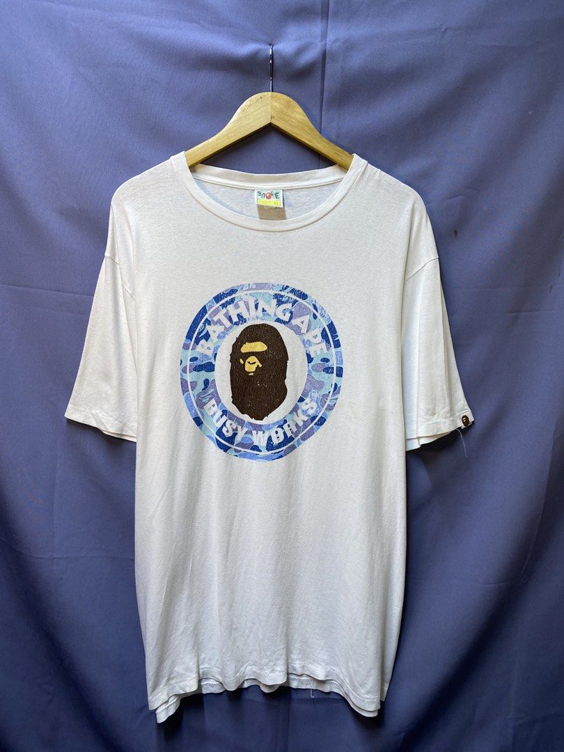 AUTHENTIC BAPE “BUSY WORKS” (Category: Tshirts & Polo Shirts ) located in Makati City. Submitted by drip.poww (Listing ID 1469822762, Image 1). Description: - Authentic Bape - Color: white - Size: XL - Dimes: 24x30 - Authentic - Hairlines / Cracks - Excellent condition - Need wash, fresh from bale - Material: 100% Cotton Please don’t expect too much—these are thrifted (ukay) items. 😊 !!STILL NEGOTIABLE!!.