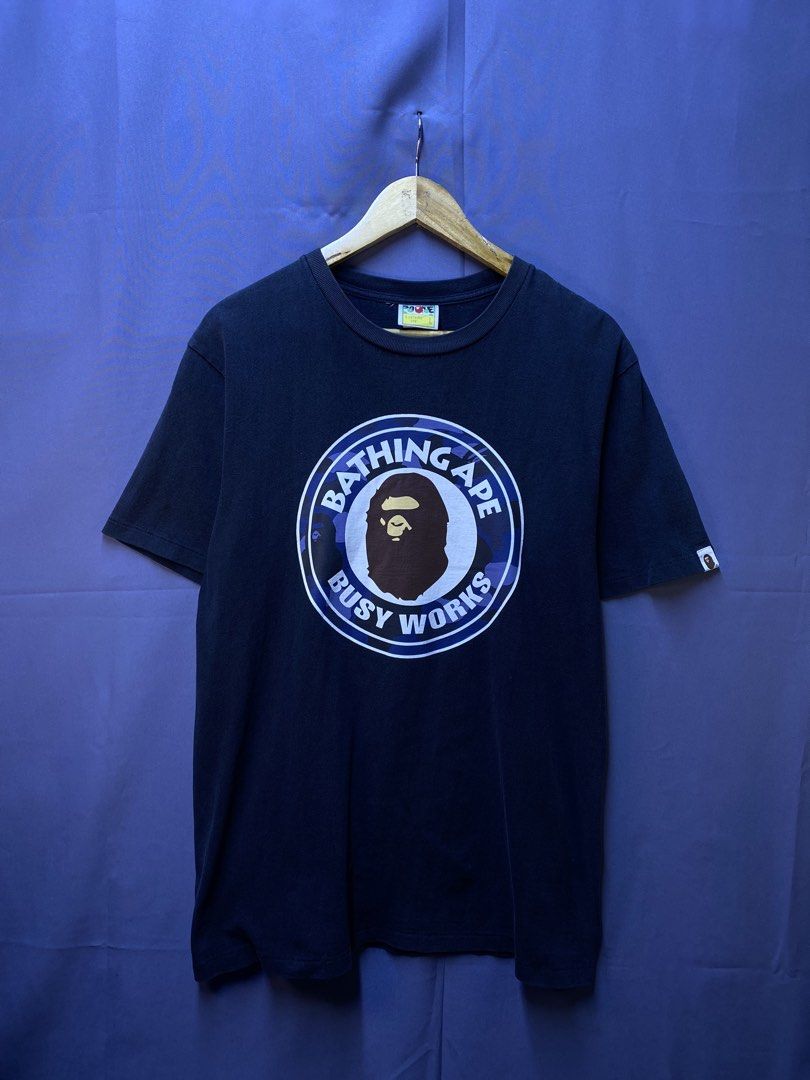 AUTHENTIC BAPE “BUSY WORKS” TEE (Category: Tshirts & Polo Shirts ) located in Makati City. Submitted by drip.poww (Listing ID 1469828802, Image 1). Description: - Authentic Bape - Color: Black - Size: Large - Dimes: 22x28 - Authentic - Excellent condition - Need wash, fresh from bale - Material: 100% Cotton Please don’t expect too much—these are thrifted (ukay) items. 😊 !!STILL NEGOTIABLE!!.