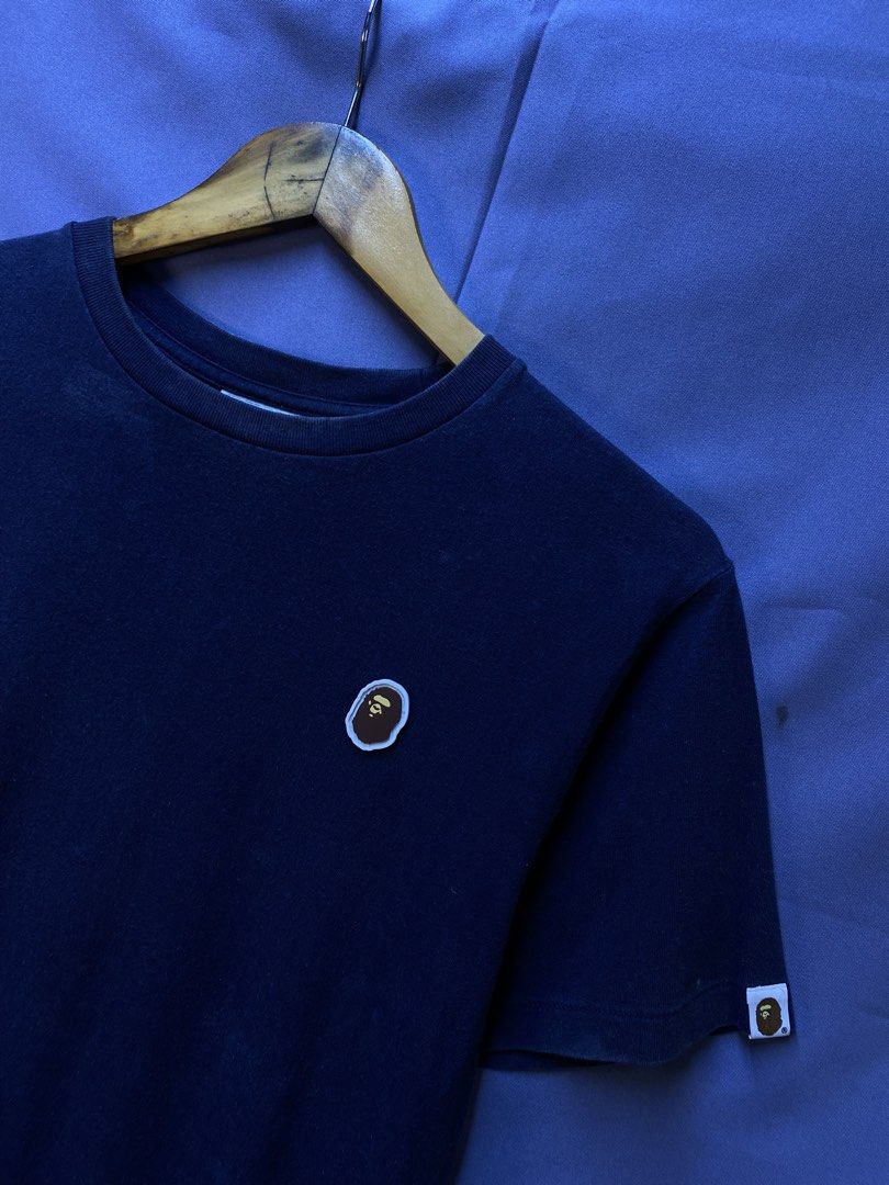 AUTHENTIC BAPE “point” TEE (Category: Tshirts & Polo Shirts ) located in Makati City. Submitted by drip.poww (Listing ID 1469821074, Image 2). Description: - Authentic Bape - Color: Navy blue - Size: Small - Dimes: 19x25 - Authentic - Excellent condition - Need wash, fresh from bale - Material: 100% Cotton Please don’t expect too much—these are thrifted (ukay) items. 😊 !!STILL NEGOTIABLE!!.