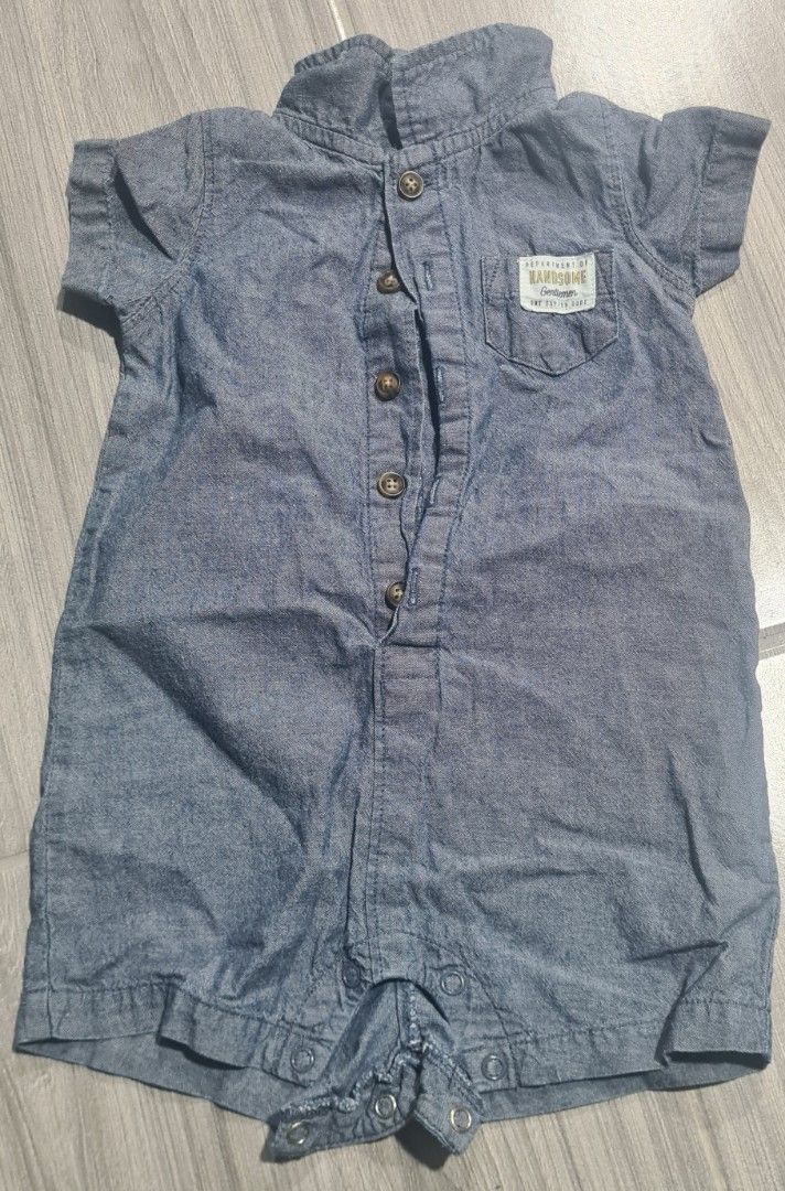 Authentic Carter's Baby Boy Chambray Romper (Category: Babies & Kids Fashion) located in Marikina City. Submitted by reloved.closet26 (Listing ID 1469818740, Image 1). Description: • Brand: 100% Authentic Carter's • Style: Short-sleeve chambray polo romper with collar, button-front, pocket accent, and easy bottom snaps for quick diaper changes. • Condition: Excellent Used Condition (EUC) / Very clean, no stains, no fades, snaps work perfectly..