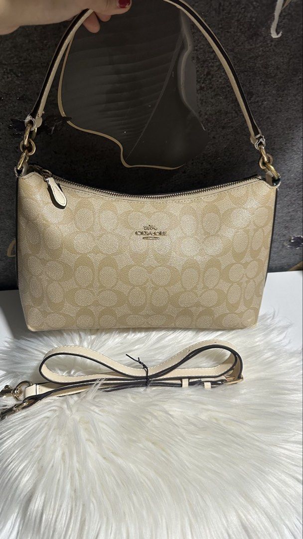 Authentic coach lewis (Category: Shoulder Bags) located in Caloocan City. Submitted by trebdy01 (Listing ID 1469901479, Image 3). Description: Authentic Coach Lewis Shoulder Bag in Signature Canvas Selling my beautiful, 100% authentic Coach Lewis Bag in Khaki/Chalk. This is a super versatile 2-way bag that transitions easily from an elegant shoulder bag to a casual everyday crossbody! ✨ Product Details: • Model: Coach Lewis Shoulder Bag (Style No