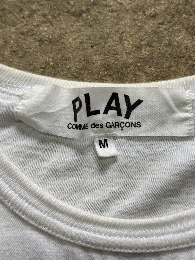 Authentic Comme Des Garcons PLAY White Spray Hearts Tshirt (Category: Tshirts & Polo Shirts ) located in Badian. Submitted by choloknows (Listing ID 1469827053, Image 3). Description: Excellent 9.5/10 Size M on tag 19 W x 25 L No issue Need wash 1200 + sf.
