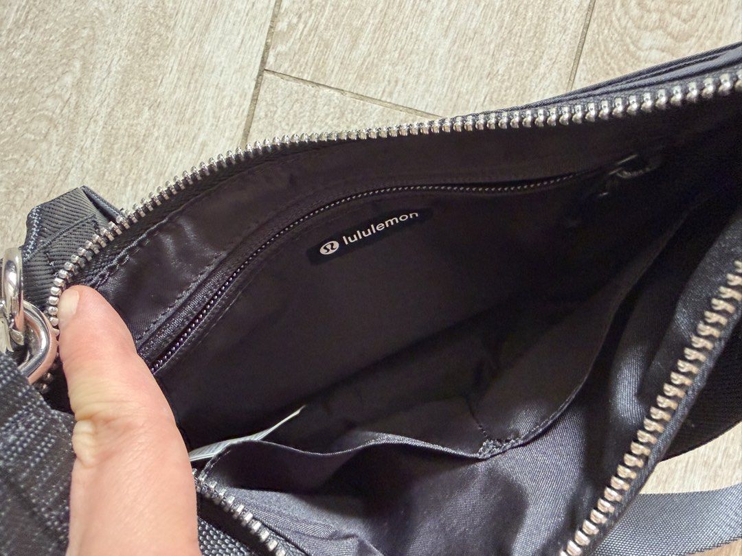 Authentic Lululemon City Essentials Bag Black (Category: Cross-body Bags) located in Quezon City. Submitted by the.happy.mommy (Listing ID 1469803249, Image 3). Description: - Brand: Lululemon - Model: City Essentials Bag - Color: Classic Black - Condition: Excellent / Like New - Material: Durable, high-quality nylon - Features: Secure zip closure, interior pockets for easy organization, adjustable strap - Authentic product with original tag and 