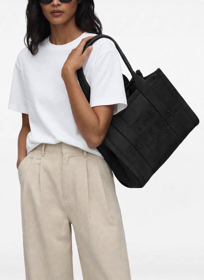 Authentic Marc Jacobs Medium Puffer Tote Black (Category: Tote Bags) located in Manila. Submitted by essential.shop.ph (Listing ID 1469931233, Image 2). Description: FOR PRE-ORDER. 7-10 days ETA ☺️ Authentic Marc Jacobs Nylon Medium Puffer Tote Cement color Top zip closure Top handle 2 external side pockets 1 Interior Slip Pocket, 1 Interior Zip Pocket Polyester Lining Includes paper bag, dust bag, tag and care cards. Dimensions L 33cm x D 15cm D