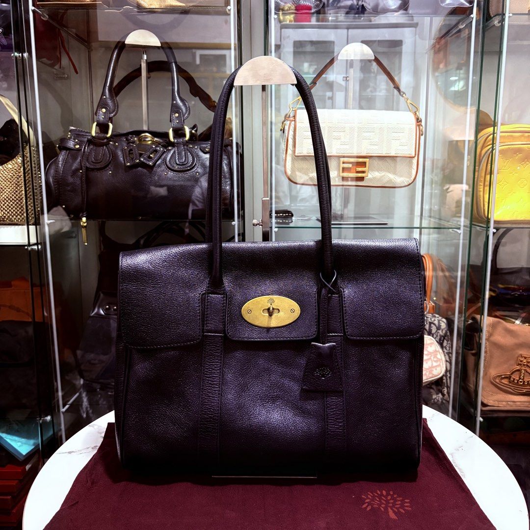 Authentic Mulberry Black Bayswater Bag (Category: Luxury Bags & Wallets) located in Binangonan. Submitted by makoleksyon (Listing ID 1469791881, Image 1). Description: Excellent condition Like new No flaws Comes with dust bag Size: H-10 x W-14 x D-6 inches Bought in Japan 💯% Authentic Money back guarantee .