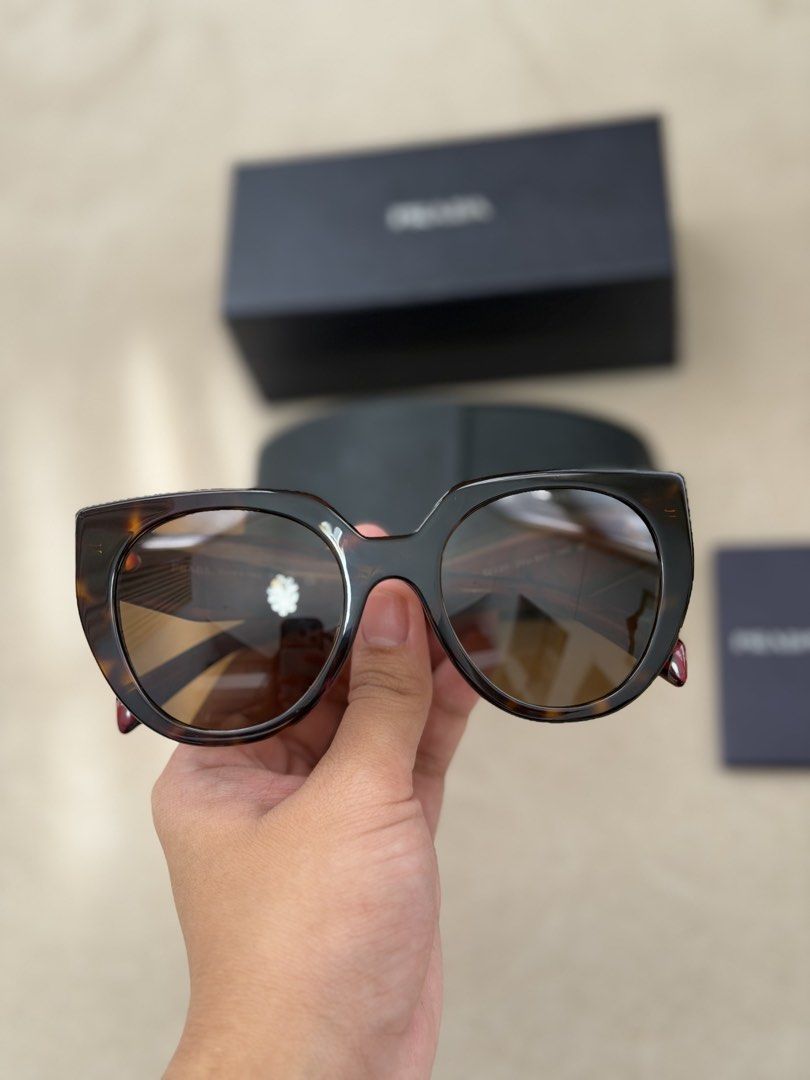 Authentic Prada Cat-eye Sunglasses (Category: Sunglasses & Eyewear) located in Manila. Submitted by maria_2326 (Listing ID 1469927591, Image 2). Description: 💯% Authentic W/box, case, booklet Location: Manila/QC.