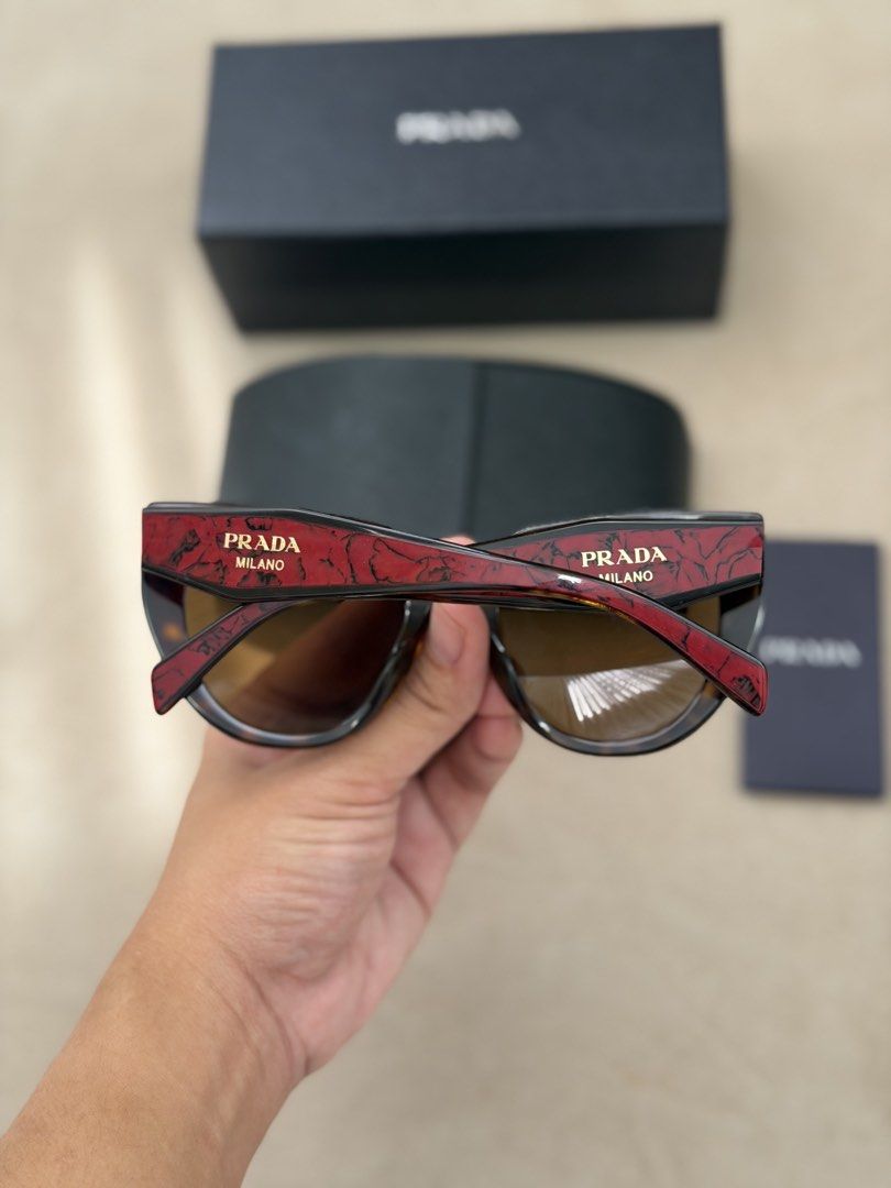 Authentic Prada Cat-eye Sunglasses (Category: Sunglasses & Eyewear) located in Manila. Submitted by maria_2326 (Listing ID 1469927591, Image 3). Description: 💯% Authentic W/box, case, booklet Location: Manila/QC.