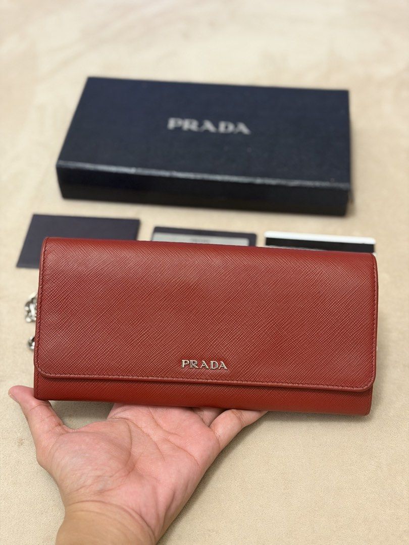 Authentic Prada Saffiano Burgundy Wallet on Chain (Category: Wallets & Card holders) located in Manila. Submitted by maria_2326 (Listing ID 1469927768, Image 2). Description: 💯% Authentic w/box, sling, prada card, booklet Location: Manila/QC.