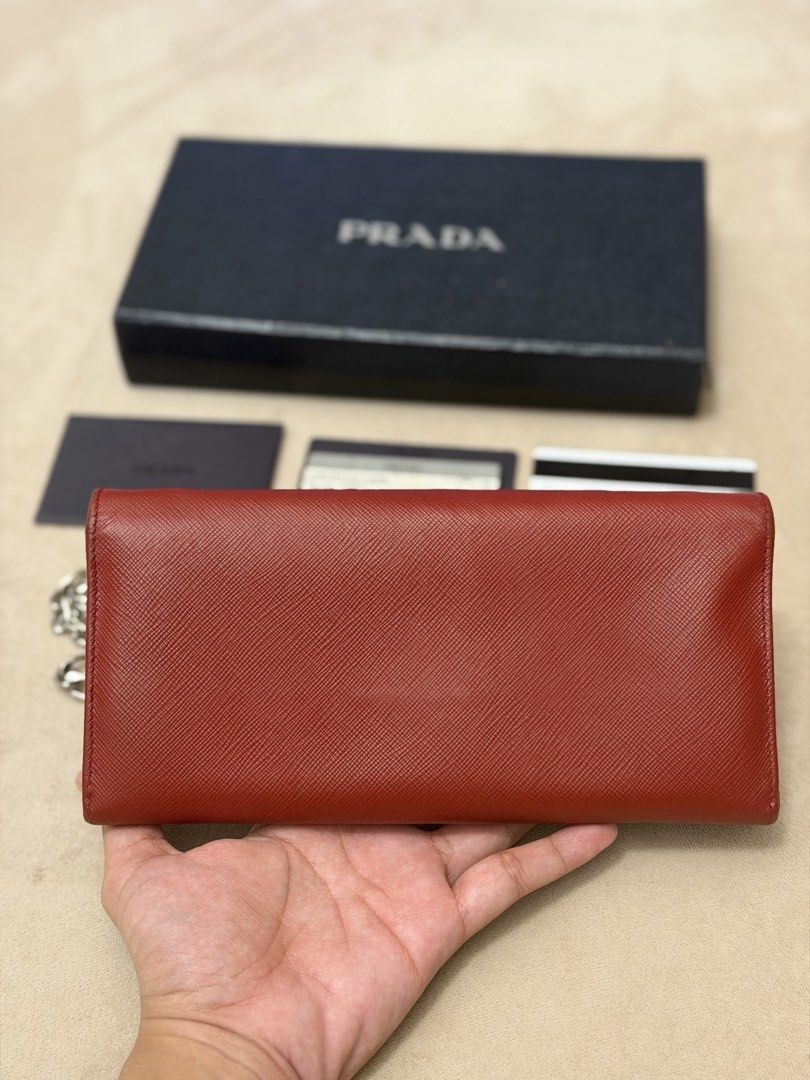 Authentic Prada Saffiano Burgundy Wallet on Chain (Category: Wallets & Card holders) located in Manila. Submitted by maria_2326 (Listing ID 1469927768, Image 3). Description: 💯% Authentic w/box, sling, prada card, booklet Location: Manila/QC.
