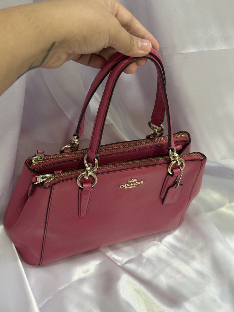 Authentic Preloved Coach Mini Christie (Category: Luxury Bags & Wallets) located in Basista. Submitted by glesylbd_22 (Listing ID 1469781593, Image 2). Description: - With sling - No major issues normal signs of use only - Intact rubber linings, - Material: Saffiano Leather - Color: Bright pink - Handles: Dual top handles - Closure: Zip closure - Inclusion: Matching leather hangtag - Interior: Clean lining with multiple compartments - Condition/U