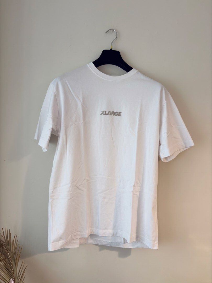 Authentic XLARGE Standard Reflectorized Logo Shirt (Category: Tshirts & Polo Shirts ) located in Mandaluyong City. Submitted by material_boi (Listing ID 1469797949, Image 1). Description: XLARGE is a cult classic streetwear. Store bought, not thrifted or something. Used once, launderer once. Tag says L: approx 21 inches wide and 28 inches long. 100% cotton. No issue. Perfect for hypebeast people. RFS: decluttering.