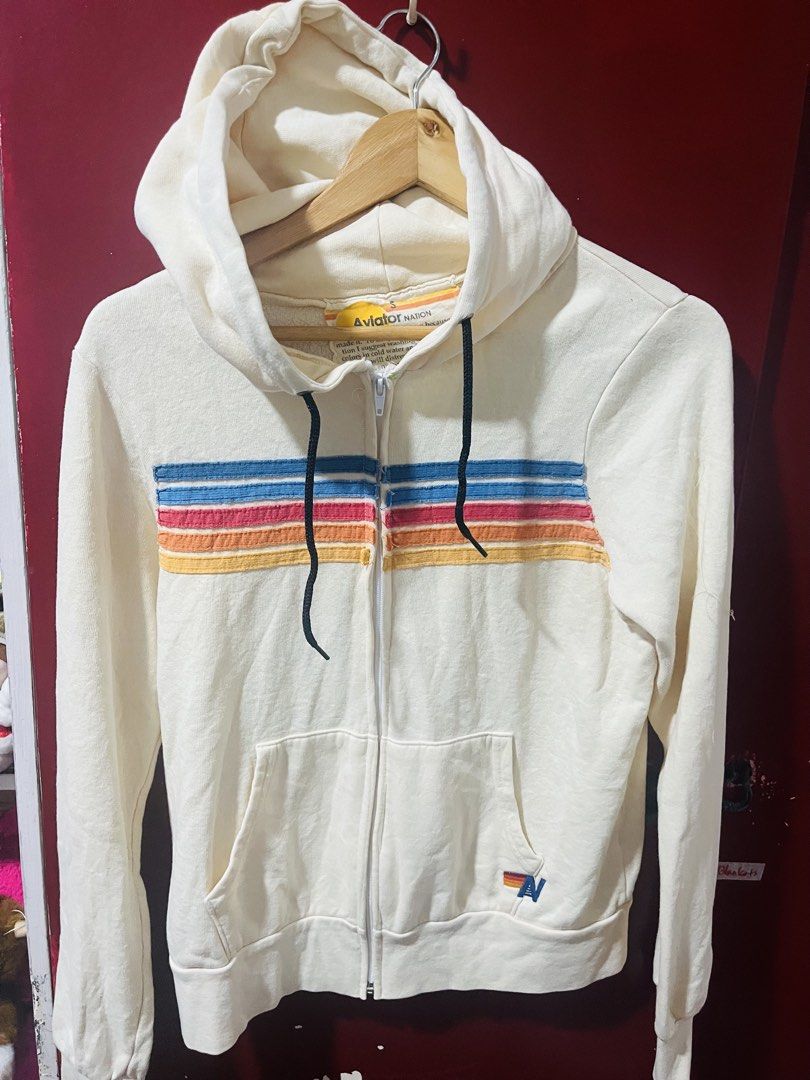Aviator Nation 5-Stripe Zip Hoodie (Category: Coats, Jackets and Outerwear) located in Quezon City. Submitted by wacpon_061972 (Listing ID 1469873079, Image 1). Description: This signature California-surf lifestyle piece is handmade in Los Angeles. It features an intense factory breaking-down process that provides its iconic, distressed vintage feel from day one. It is constructed using a premium tri-blend fleece fabric, accented by five colorful