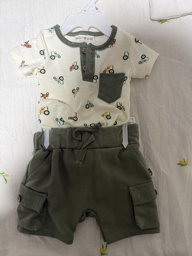 Baby boy ootd (Category: Babies & Kids Fashion) located in Batangas. Submitted by sssyychic (Listing ID 1469876590, Image 1). Description: - Adorable 2-piece set for baby boys - Cream organic cotton short sleeve top with colorful tractor prints, front pocket, and button neckline - Solid olive green cargo shorts with side pockets - Adjustable drawstring waist for a comfortable fit - Made with soft, breathable material for everyday wear - Brand new