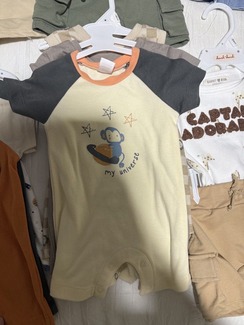 Baby boy Romper My Universe Monkey Print 3pcs (Category: Babies & Kids Fashion) located in Batangas. Submitted by sssyychic (Listing ID 1469873040, Image 1). Description: - Color: Light yellow with dark grey raglan sleeves and vibrant orange neckline - Design: Cute monkey holding a planet graphic with 'my universe' text and scattered star prints - Feature: Convenient button snaps at the bottom for quick and easy diaper changes - Material: Soft, b