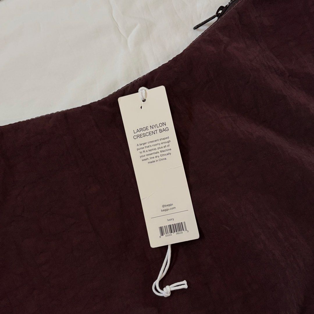 baggu large nylon crescent ✶ ivory → red wine (Category: Cross-body Bags) located in Caloocan City. Submitted by turbobaachan (Listing ID 1469824548, Image 2). Description: baggu large nylon crescent price: ₱1,250 ⤷ color: originally ivory, personally dyed red wine; shade is similar to baggu’s chocolate plum ⤷ strap: professionally altered; maximum length is 23” ⤷ condition: like new, only used for the dyeing process ⤷ flaws: none rfs: declutteri