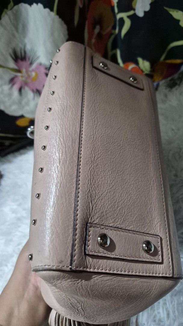 Balmain Paris Pink Leather Handbag with Studs (Category: Luxury Bags & Wallets) located in Baguio. Submitted by jhaz_bags (Listing ID 1469901809, Image 3). Description: - Authentic Balmain Paris handbag in a stunning pink leather - Structured design with dual top handles for easy carrying - Chic silver-tone hardware and edgy metal stud accents along the borders - Signature debossed logo stamp on the front panel - Secure zippered top closure and p